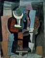 Compotier y botella sobre una mesa 1920 cubismo Pablo Picasso